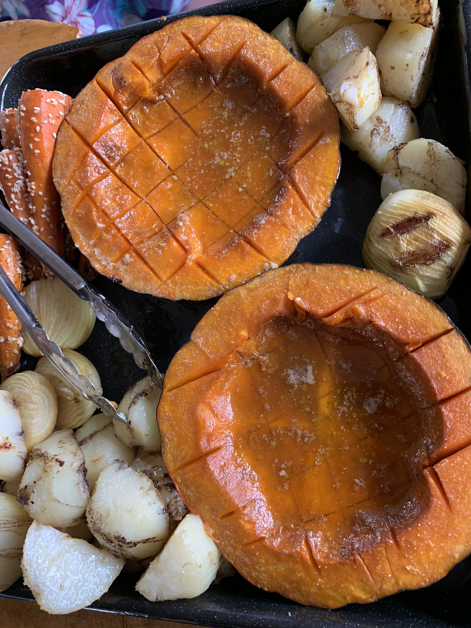 The pumpkins, along with onions, carrots, and potatoes.  All the scoring in the potatoes has opened up and there's still lots of liquid in the pumpkin-bowl.