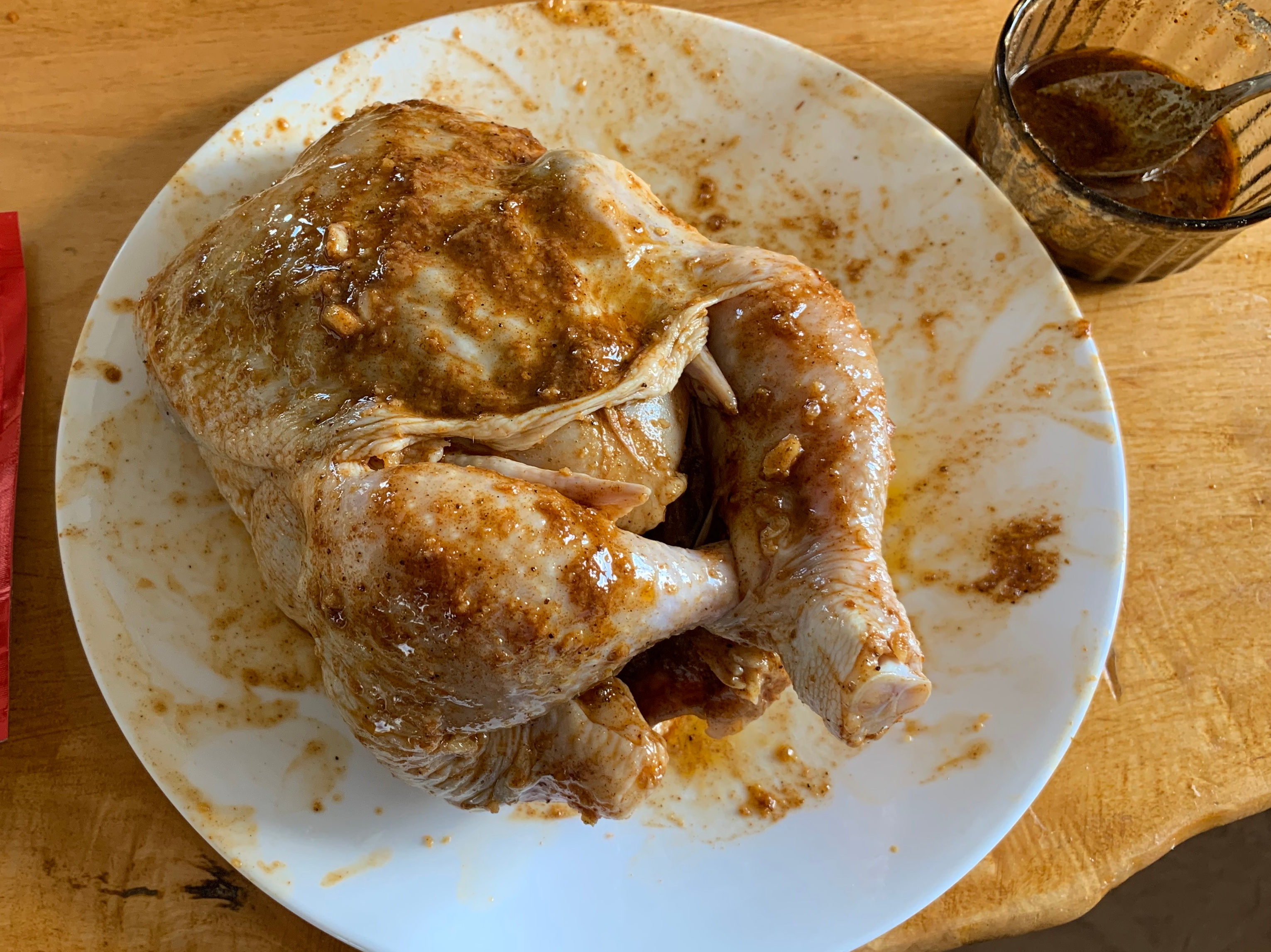 Another chicken, this time rubbed with Leena Spices' Portuguese spice.  It's a bit more red, with visible garlic chunks.