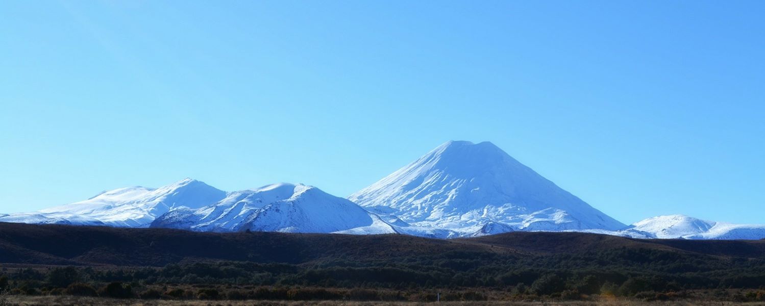 Landscape photography of Mount Tongariro and Mount Ngauruhoe, covered in white snow