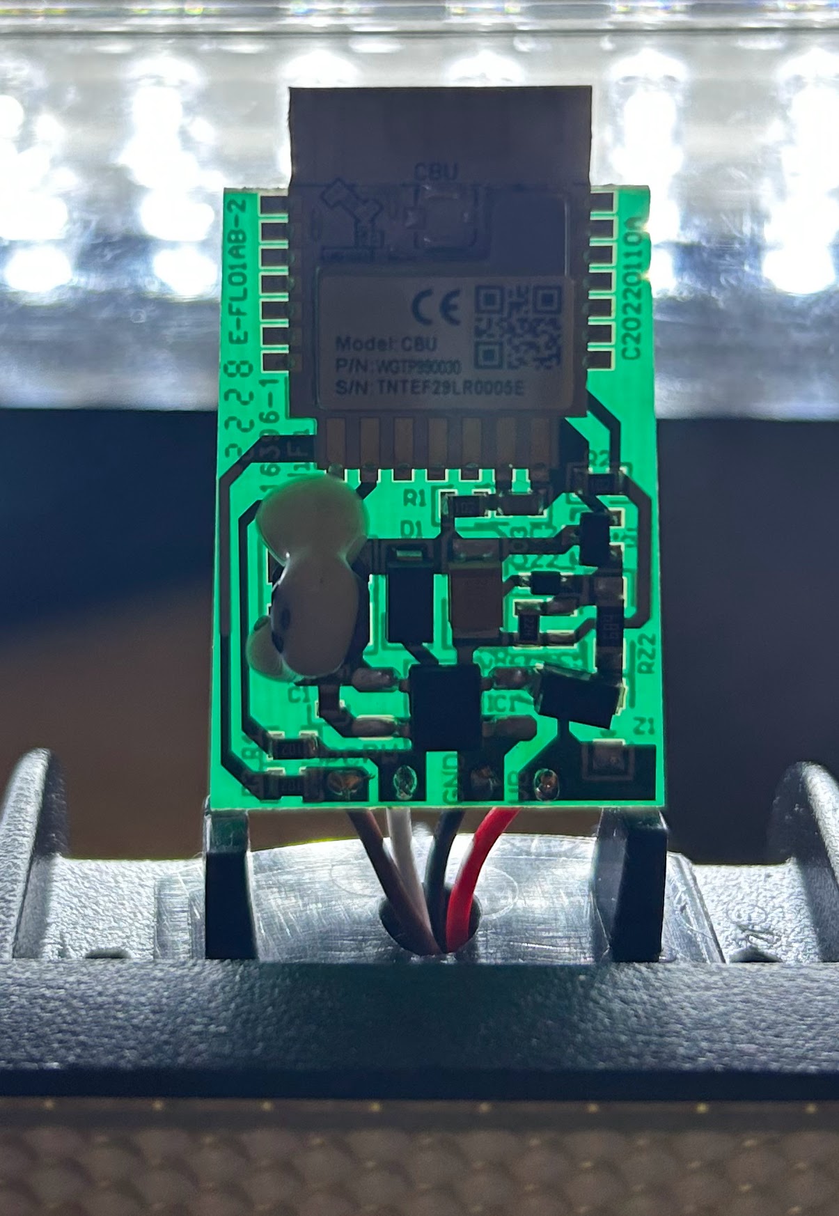 The control board lit from behind, showing its traces